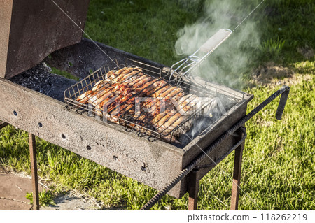 Frying meat on the grill 118262219