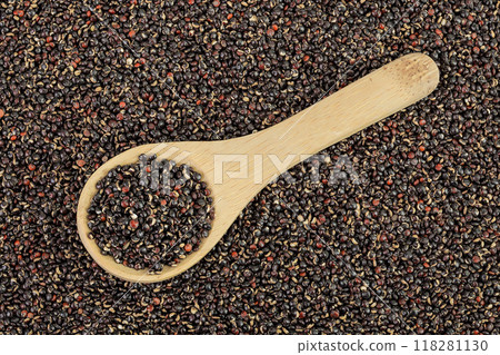 black quinoa in wooden spoon as a background. Top view. Flat lay 118281130