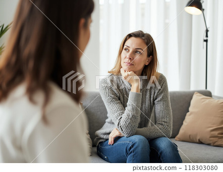 Doctor assisting a patient in a wheelchair 118303080