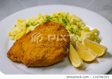 Chicken cutlet with couscous and lemon 118396305