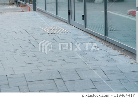 Urban Gray Paving: A Contemporary Sidewalk Atmosphere 119464417