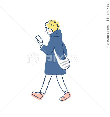 A young man walking while looking at his smartphone 119480745