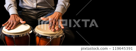 Close-up of the Hands of a Percussionist Playing Bongos on Black Background - Generative Ai 119645391