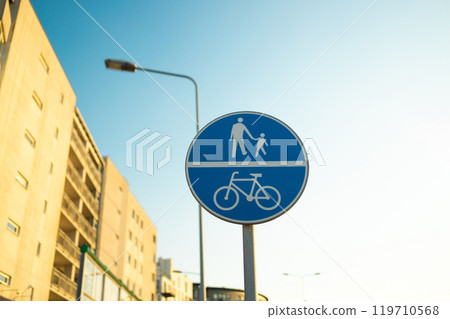 Shared route for use by pedal cycles and pedestrians only metal sign on post, white symbols on blue 119710568