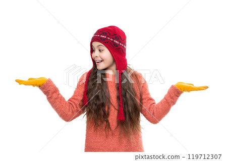 Winter fashion style trend. Teen girl in hat enjoying childhood. Girl wearing trendy outfit with knitted beanie hat. Girl with winter hat isolated on white. Woolly clothes 119712307