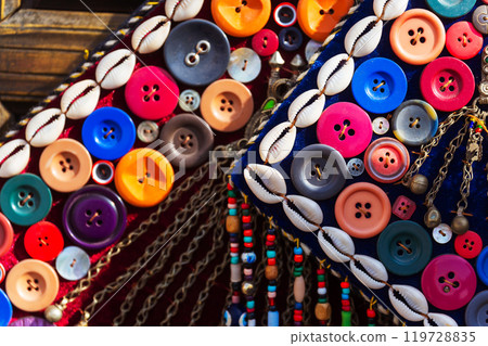 Closeup of a purse decorated with buttons and beautiful shells 119728835