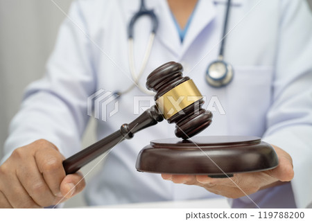 Doctor holding judge gavel, forensic medicine, medical law and crime justice concept. 119788200