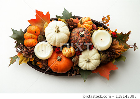 Autumn flat lay featuring pumpkins, candles, and leaves background. Concept of fall, harvest, and Halloween decoration 119145395