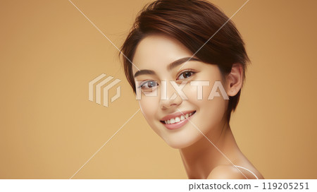 Portrait of a beautiful, sexy, smiling Asian woman with short hair, with perfect skin, golden background, banner. 119205251