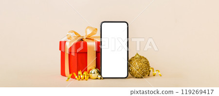 Digital phone mock up with rustic Christmas decorations for app presentation with empty space for you design. Christmas online shopping concept. Tablet with copy space on colored background 119269417