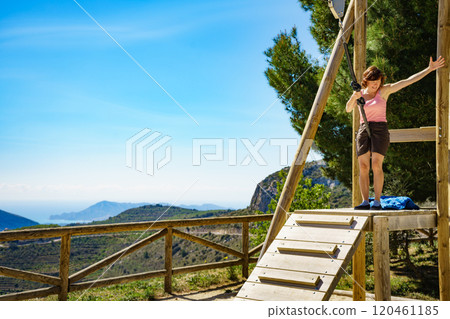 Adult woman having fun on zipline 120461185