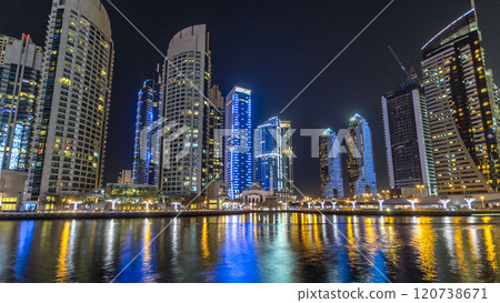 Dubai Marina towers and canal in Dubai night timelapse hyperlapse 120738671