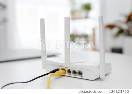 Modern wi-fi router on light table in room 120823750