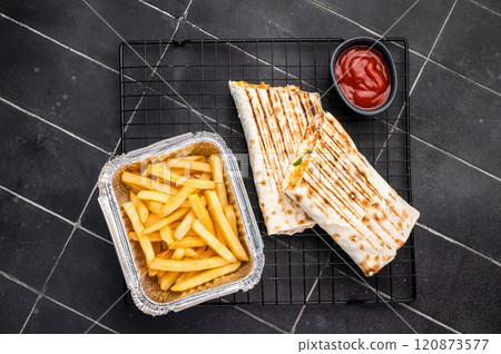 Turkish Shawarma, doner wrap sandwich with meat and salad. black background. top view 120873577