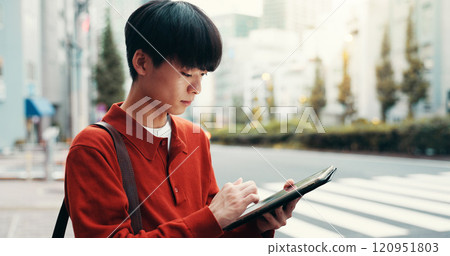 City, scroll and man in street with tablet, morning commute or road navigation search on crosswalk. Urban, travel and Japanese university student on pedestrian crossing with digital app for research 120951803