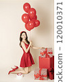 A woman in her 20s posing with a balloon 120010371