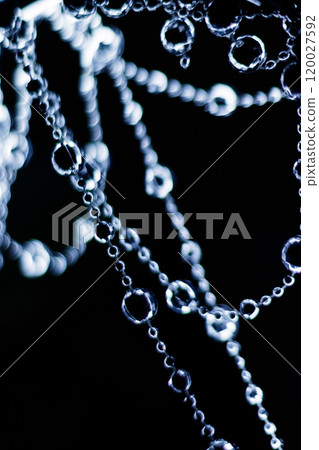 Crystal beads hanging disco garland shining on dark background. Christmas, New Year 2025 120027592