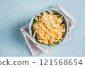 Close up of pickled sauerkraut with carrots in a bowl on the table top view 121568654