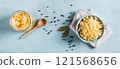 Homemade fermented cabbage in a bowl on the table top view web banner 121568656