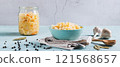 Pickled sauerkraut with carrots in a bowl on the table web banner 121568657