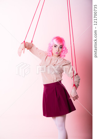 woman girl stylized like marionette puppet on string 121700735