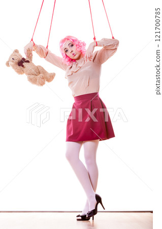 woman girl stylized like marionette puppet on string 121700785