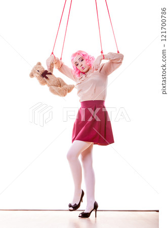 woman girl stylized like marionette puppet on string 121700786