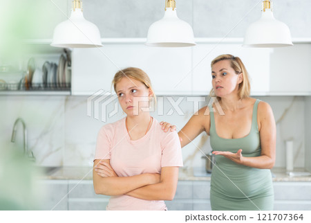 Angry mother yells at teenage girl sad daughter 121707364