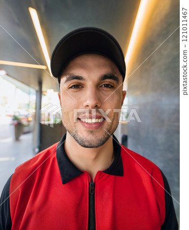 Male Fast Food Worker with Urban Aesthetic 121011467