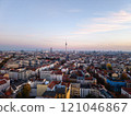 Golden hour sunset over Berlin cityscape with iconic landmarks and residential buildings, creating a stunning urban landscape in Germany Capital 121046867