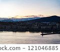 Mesmerizing sunrise over Lake Geneva with majestic Alps and vibrant clouds, creating a picturesque scene in Switzerland, Europe 121046885