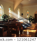 Serene church interior with sunlight and elegant funeral setup in a bright chapel 121061247