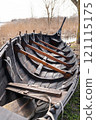 Detailed view of the interior of a Viking longboat, highlighting wooden ribs, ropes, and traditional construction techniques 121115175