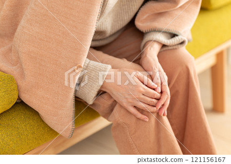 Middle-aged to senior women suffering from knee pain 121156167