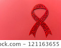 Red ribbon on red background 121163655