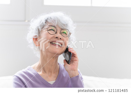 Senior woman talking on a smartphone 121181485