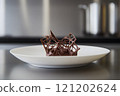 A beautifully crafted chocolate dessert sits elegantly on a plate. 121202624