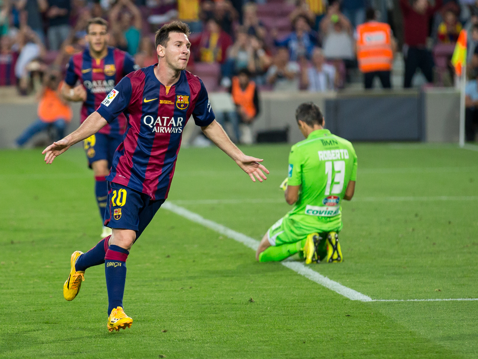 Messi celebrating scoring a goal against Granada CF in October 2014.