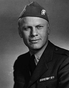 The head and shoulders of a man in a World War Two-era uniform of the United States Navy.