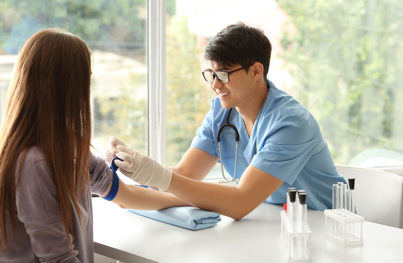 a teenager taking a mono exam