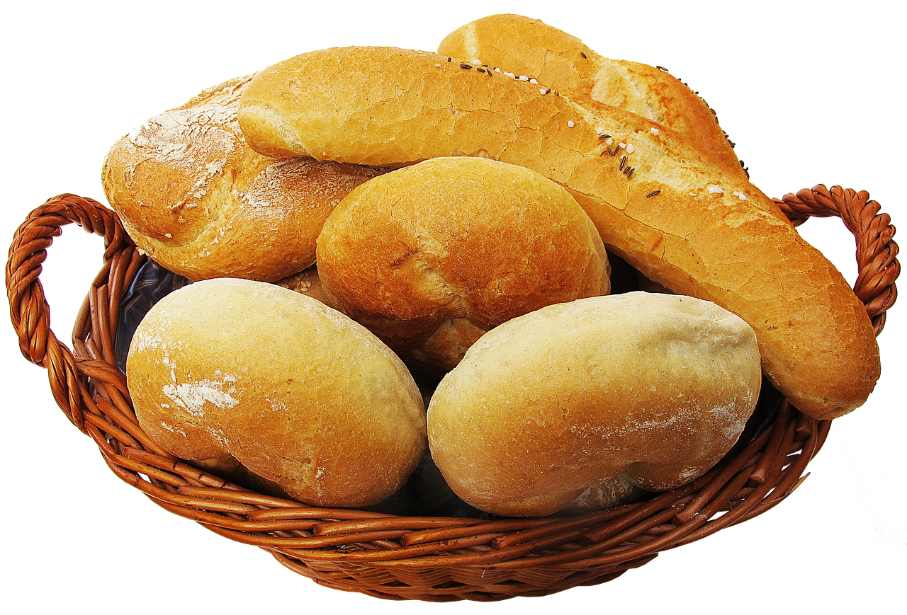 A Basket Of Bread On A Black Background