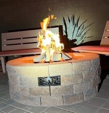 A fire pit with a bench and some benches