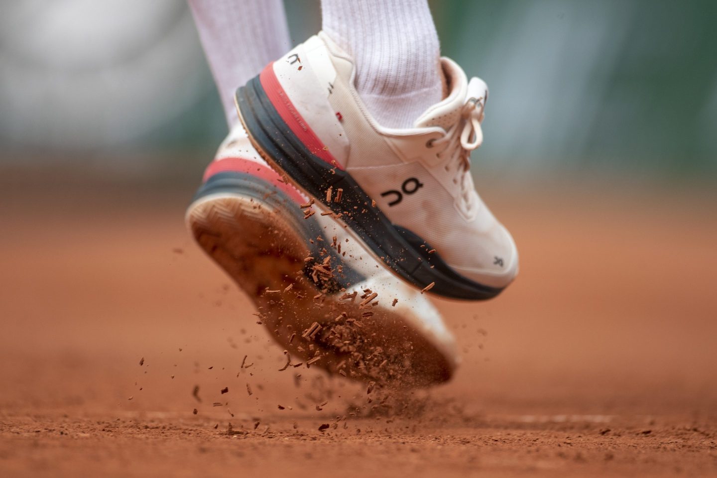 PARIS, FRANCE June 3. Clay falls from the soles of Roger Federer of Switzerland"u2019s tennis shoes during his match against Marin Cilic of Croatia on Court Philippe-Chatrier during the second round of the singles competition at the 2021 French Open Tennis Tournament at Roland Garros on June 3rd 2021 in Paris, France. (Photo by Tim Clayton/Corbis via Getty Images)