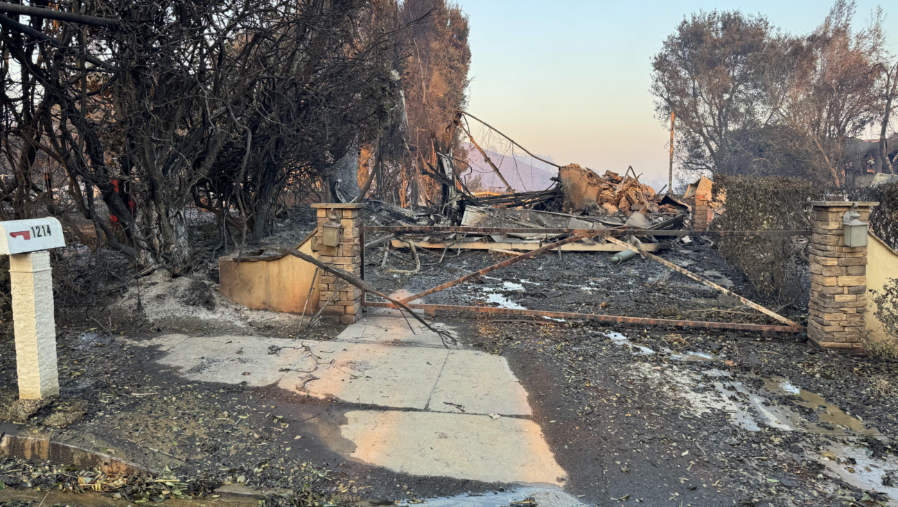 Dave and Jen Miner's home after the Palisades Fire destroyed it last week. Among the many possessions they lost was their ketubah, or Jewish marriage contract, from their 1994 wedding. 