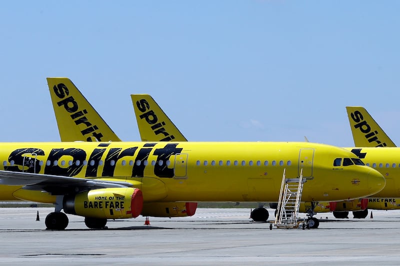 FILE - A line of Spirit Airlines jets sit on the tarmac at Orlando International Airport on...