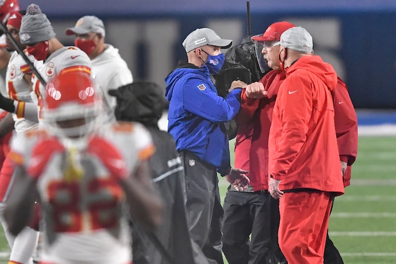 Kansas City Chiefs head coach Andy Reid, right, greets Buffalo Bills head coach Sean McDermott...