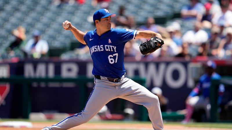 Kansas City Royals starting pitcher Seth Lugo throws to the plate during the first inning of a...