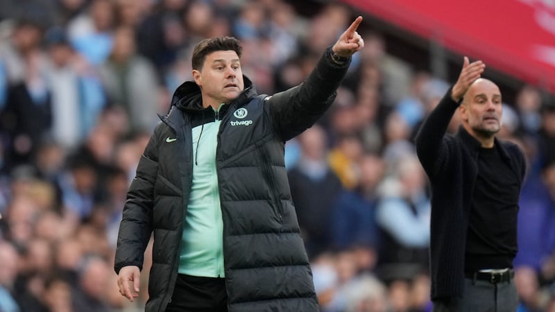 FILE - Chelsea's head coach Mauricio Pochettino, left, and Manchester City's head coach Pep...