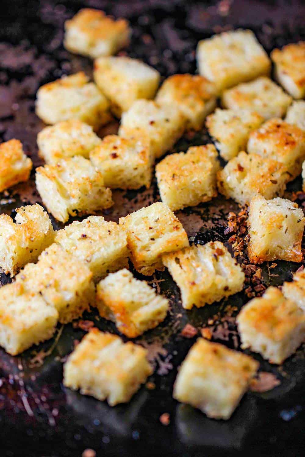 Baked crispy croutons on a baking sheet