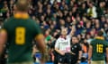 Referee Wayne Barnes issues a red card to New Zealand's Sam Cane in the 2023 World Cup final.